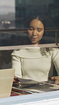 Woman, meeting and paperwork in office with window, insight or discussion for public relations plan. Person, conversation and planning in business with document, PR statement or brand management idea