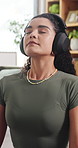 Calm, home and woman with headphones for meditation, inner peace and mindfulness with ambient sound. Zen, music and happy person with mobile for song selection, mental health and wellness on break