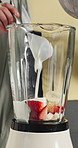 Hands, blender and fruit in home with yogurt for smoothie with wellness, detox or diet in kitchen. Person, appliance and healthy food with organic banana, strawberry and nutrition at apartment