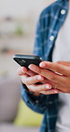 Hands, typing and woman in home, phone for social media and digital app for communication. Mobile user, internet or person in lounge, tech for online chatting and email notification with website info