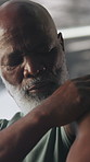Fitness, exercise and black man in gym with shoulder pain, injury or accident for workout. Health, wellness and mature African male person with muscle sprain or arthritis for training in sport center