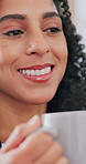 Drinking coffee, smile and woman in home, thinking and reflection with caffeine, wonder and morning. Remember, routine or person in lounge, happiness and cup for herbal tea, thoughtful and comfort