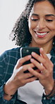 Woman, laugh and relax on sofa with phone, watch internet comedy and online meme for social media post. Happy, female person and scroll in home with tech, mobile app and humor for funny text message.