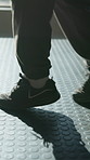 Feet, athlete and boxing drills at gym for sparring footwork, enhance balance and range control. Combat sport, shoes and person with jabbing at health club for fight preparation, agility and defense