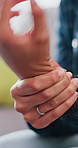 Woman, hands and wrist pain in home with arthritis, massage or symptoms for carpal tunnel syndrome. Person, stretching or joint inflammation in house with nerve injury, tendinitis or medical problem.