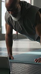 Fitness, push up and black man in gym for muscle building, workout or arm training with wellness. Health, athlete and mature male person with strength for exercise or practice in sports center.