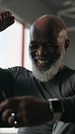 Happy, black man and fist pump with phone in gym for workout goals, target or achievement. Excited, mature or active male person with smile or celebration on smartphone for performance in health club