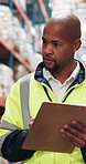 Man, inspection and writing in warehouse with clipboard, plan or stock count to track order picking. Black person, review and checklist for inventory management, supply chain and notes for logistics.