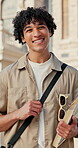 College, face or man on campus with book, knowledge or scholarship in study opportunity. Happy, education or student outdoor with confidence, university funding or academic development in Australia.