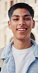 Face, man and student with smile at school for education, scholarship and studying abroad. Portrait, male person and happy with backpack at campus, learning opportunity and knowledge at university