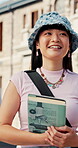 Walking, student or woman thinking with book on campus, college course or biology lecture for education. Outdoor, reflection or person with studying for life science knowledge, class journey or smile
