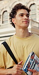Walking, thinking or man with book on campus, academic institute visit or smile for future education. Outdoor, reflection and student with tour of university, attendance vision or scholarship mindset