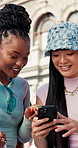 Friends, students and discussion at university with phone, social media gossip and bonding together. Happy, women and conversation outdoor at college with tech, mobile app and internet for blog post.