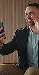 Phone, video call and wave with business man in airport for break, conversation or feedback. App, communication and greeting with happy employee in departure lounge for travel or virtual meeting
