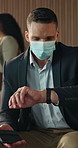Businessman, face mask or checking with watch in waiting room for business travel, commute or flight. Man, employee or traveler with wristwatch in airport lounge for schedule time or delay departure