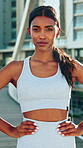 Fitness, face and woman with confidence in city to start exercise, morning cardio or wellness. Personal trainer, serious athlete and ready outdoor for runner workout, sports practice or health pride