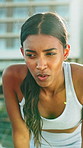 Thinking, woman and fitness in city, tired and athlete with health goals and cool down with fatigue. Runner, breathe and person with exhaustion on break, wellness and outdoor with burnout or recovery