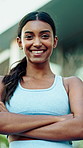 Happy, fitness and face of woman in city with confidence for runner, workout or training with health. Crossed arms, athlete and portrait of female person with pride for sports, exercise or active.