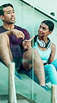 Outdoor, talk and couple on fitness break, morning and planning for health goals and rest on stairs. City, steps and people with ideas for wellness, conversation and practice together on weekend