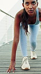 Fitness, serious and woman with start position in city for runner, workout or training outdoor. Sports, health and female person with tying laces for cardio exercise or practice in urban town. 