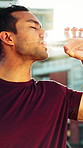 Fitness, drinking water or man in town with break, cardio rest or hydration support in outdoor practice. Refresh, flare or runner with h2o beverage, cool down or exercise pause with recovery.