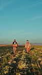 Agriculture, couple and walk with vegetables on field for harvest, food production or agribusiness. Farmer, people and sustainable farming with crate for fresh produce, healthy crops and mockup space