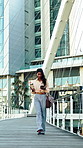Businesswoman, commuting and chat with phone in city, communication and travel with coffee on street. Outdoor, employee and person with beverage on walk, reading and texting with mobile and message