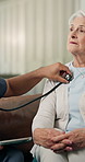 Caregiver, stethoscope and senior woman in home for assessment, breathing and asthma. Nurse, tablet and listening to heartbeat of elderly person, chest evaluation and lungs sound for medical wellness