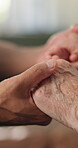 Caregiver, support and holding hands with old person in nursing home, help and recovery with comfort. Assisted living, nurse and care with elderly patient, healthcare and kindness for rehabilitation