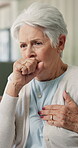 Sick, cough and old woman in home with chest pain, medical emergency and symptoms for asthma attack. Elderly person, health crisis or respiratory infection in house with flu, virus and lung disease.