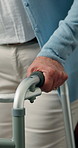 Hands, walker and senior woman in nursing home with balance, support or mobility for arthritis. Metal cane, patient and elderly female person with disability for recovery, medical care or wellness.