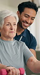 Physiotherapist, dumbbells and senior woman in home, strength training and muscle recovery exercise. Weightlifting, healing support or happy man with client for wellness, guidance or rehabilitation