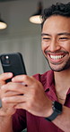 Man, typing and laugh in home with phone, online meme and notification for text message conversation. Happy, person and scroll in house with tech, mobile app and social media for funny entertainment.