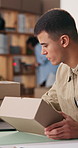 Man, small business and box with laptop in office for logistics, supply chain and ecommerce delivery. Person, package and pc for online order, inventory management and pricing parcel for distribution