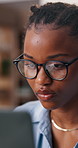 Creative, glasses and woman with laptop in office, serious and editing article on web or copywriting. Black person, research and copywriter with tech for assignment, email marketing and ad campaign