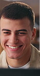 Creative, online and happy man with laptop in office, copywriting and reading article or ad campaign. Laughing, copywriter and person with tech for project, email marketing and research for blog post