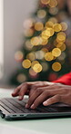 Christmas, hands or typing with laptop in home, digital holiday card or research for gift inspiration. Festive greeting newsletter, internet or person with pc for online shopping, bokeh or planning