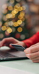 Christmas, credit card or hands with laptop in house, online shopping or festive season sale for gift. Bokeh, holiday discount or person with pc for ecommerce, present payment or typing bank details