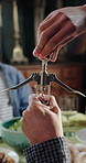 Happiness, people and open wine bottle at dinner for celebration party, social gathering and reunion. Home, hands and corkscrew for alcohol drink, start brunch event and dining together with skills