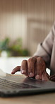 Hands, laptop and scroll with project in office, editing and graphic design career at digital company. Person, computer and review for proposal, feedback and web development at creative agency
