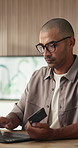 Man, credit card and laptop at office with online shopping, fintech and easy transaction at company. Person, budget and payroll manager for e commerce, typing and computer with glasses at agency