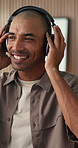 Dancing, headphones or man in agency with streaming, feeling beat or listening to music playlist. Happy, rhythm or male person in office with tech, song connection or radio subscription on audio app.