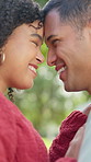 Nature, happy and couple with forehead touch for bonding, love and care on outdoor date together. Smile, marriage and man embracing woman for connection in relationship at park  for intimate moment.