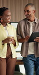 People, laugh and tablet in office with coffee, typing or proposal for funny web design conversation. Digital designer, team and humor in business with tech, drink or discussion for site development.