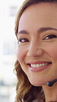 Happy woman, face or friendly agent with headset in call center office for virtual assistance. Portrait, female person or consultant with mic or smile for communication or support in contact agency