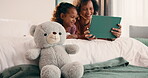 Bed, tablet and mom with daughter for bonding, watching movie or relaxing in home. Happy family, mom and child with teddy bear and reading on digital tech for comfort, support or love on weekend