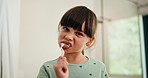 Bathroom, oral health and girl with toothbrush, brushing teeth and cavity prevention with toothpaste. Clean, mouth and child with dental care equipment for fresh breath, face and hygiene in house