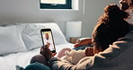 Mother, child and video call with phone screen for doctor consultation, medical advice and telehealth. Mom, daughter and online meeting in home with pediatrician, tech and contact for flu symptoms.