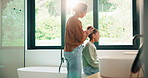 Morning, hair care and mother with child in bathroom, grooming routine and support for getting ready. Check mirror, hug and happy woman with girl for hairstyle help, flare and bonding in family home