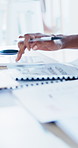 Calculator, documents and hands of business man at desk in office for annual report or finance. Budget, folder and writing with professional accountant in financial workplace for feedback or review
